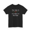 Unisex t-shirt from Twisted Angell with the sarcastic phrase “Most Likely To Overshare At The Table” printed on the front.