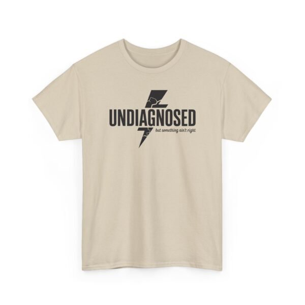 1300646369746867061_2048.jpeg Unisex t-shirt from Twisted Angell with the sarcastic phrase “Undiagnosed, But Something Ain't Right” printed on the front.