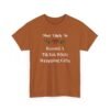 Unisex t-shirt from Twisted Angell with the sarcastic phrase “Most Likely To Record A TikTok While Wrapping Gifts” printed on the front.