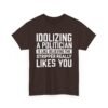 Unisex t-shirt from Twisted Angell with the sarcastic phrase “Idolizing A Politician Is Like Believing The Stripper Really Likes You” printed on the front.