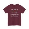 Unisex t-shirt from Twisted Angell with the sarcastic phrase “Most Likely To Get Caught Wrapping Gifts On The Clock” printed on the front.
