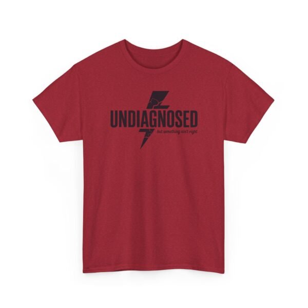 17254335461930695953_2048.jpeg Unisex t-shirt from Twisted Angell with the sarcastic phrase “Undiagnosed, But Something Ain't Right” printed on the front.