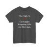 Unisex t-shirt from Twisted Angell with the sarcastic phrase “Most Likely To Get Caught Wrapping Gifts On The Clock” printed on the front.