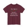 Unisex t-shirt from Twisted Angell with the sarcastic phrase “Most Likely To Record A TikTok While Wrapping Gifts” printed on the front.