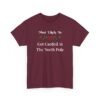 Unisex t-shirt from Twisted Angell with the sarcastic phrase “Most Likely To Get Carded At The North Pole” printed on the front.
