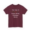 Unisex t-shirt from Twisted Angell with the sarcastic phrase “Most Likely To Watch All The Christmas Movies” printed on the front.