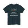 Unisex t-shirt from Twisted Angell with the sarcastic phrase “Most Likely To Record A TikTok While Wrapping Gifts” printed on the front.