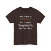Unisex t-shirt from Twisted Angell with the sarcastic phrase “Most Likely To Get Caught Wrapping Gifts On The Clock” printed on the front.