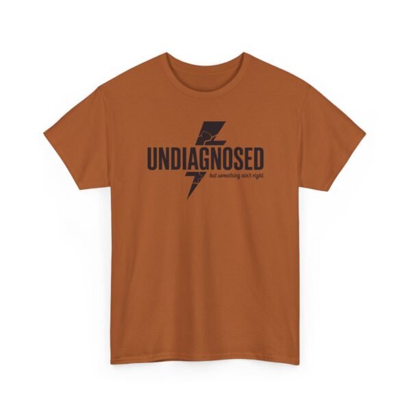 7370034666834231909_2048.jpeg Unisex t-shirt from Twisted Angell with the sarcastic phrase “Undiagnosed, But Something Ain't Right” printed on the front.