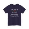 Unisex t-shirt from Twisted Angell with the sarcastic phrase “Most Likely To Record A TikTok While Wrapping Gifts” printed on the front.