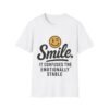 Unisex t-shirt from Twisted Angell with the sarcastic phrase “Smile. It confuses the emotionally stable” printed on the front.